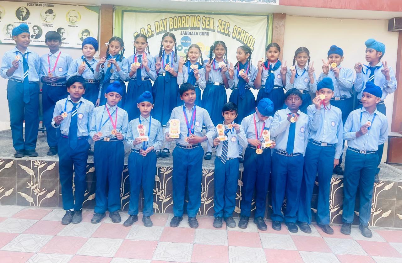 BDS students with medals and trophies